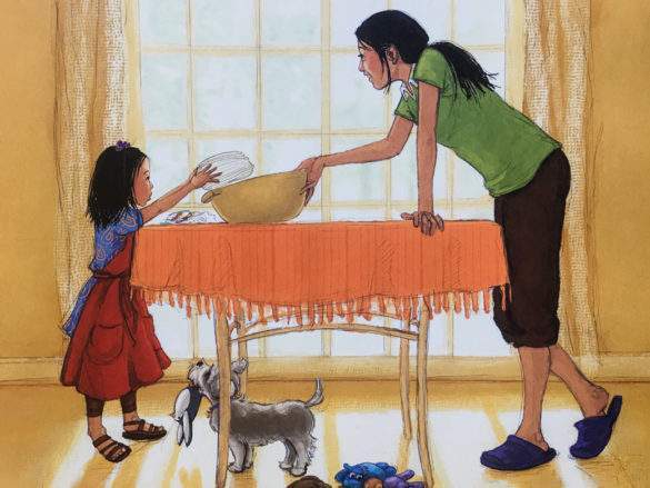 Filippina mother daughter cooking pancit