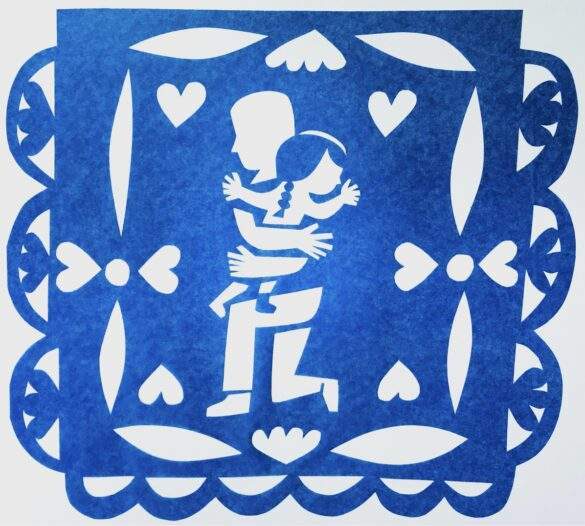Latinx girl hugs father papel de picado