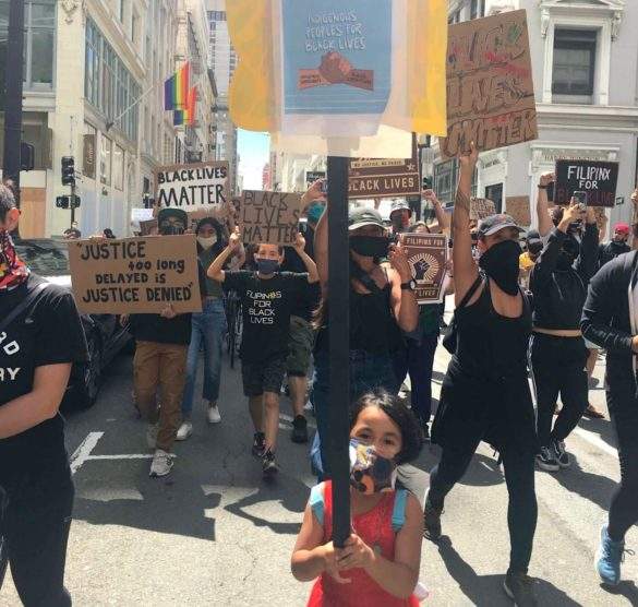 Indigenous child supporting Black Lives