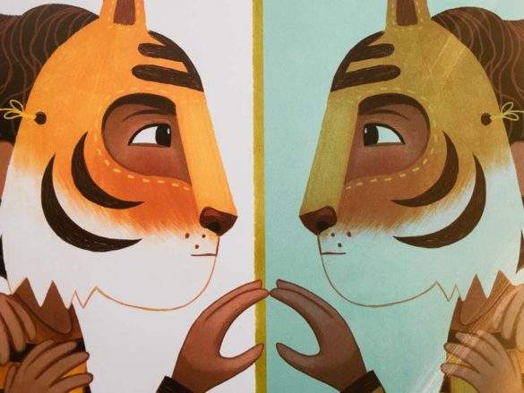 child in tiger costume mirror reflection