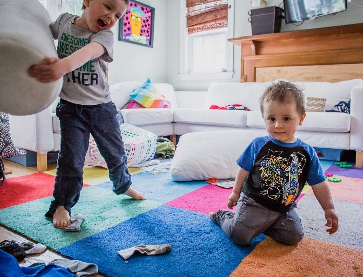 brother about to smash a toddler