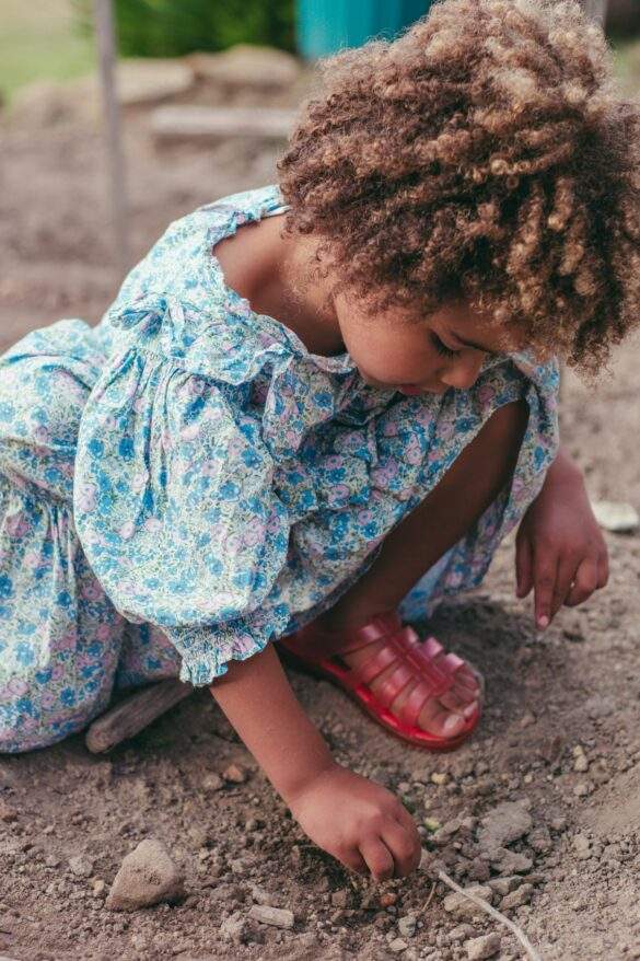child planting seed
