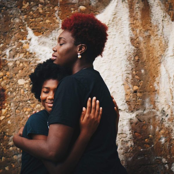 A mother and child embrace. Photo by Eye for Ebony on Unsplash